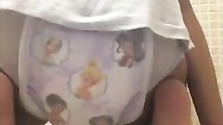 Girl messes her pullup diaper