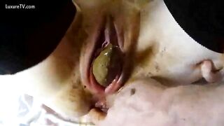 Hot slut pooping from her ass