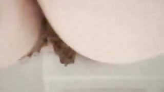 BBW girl pooping on a sofa