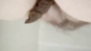 BBW girl pooping on a sofa