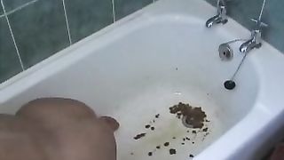 Blonde girl doing enema