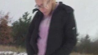 Sexy blonde girl takes a shit in the snow