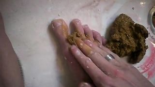 Smearing crap on her legs