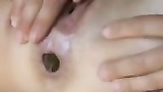 Shit while playing with her clit