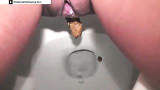 Girl pooping on toilet
