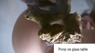 Poop on a glass table