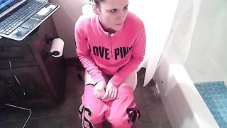 Crystal is cleaning the toilet