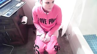 Crystal is cleaning the toilet