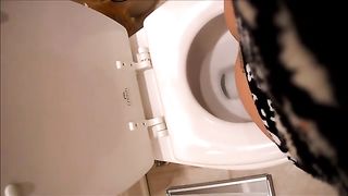 Tattooed girl pooping