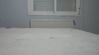 Sexy teen pooping on a white bed