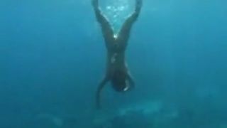 Lesbian shitting in the water