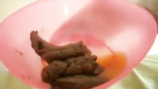 Poop in a pink bowl