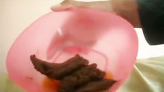 Poop in a pink bowl