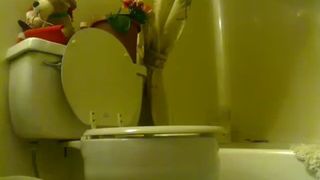 girl shits above the toilet