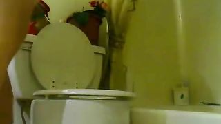 girl shits above the toilet