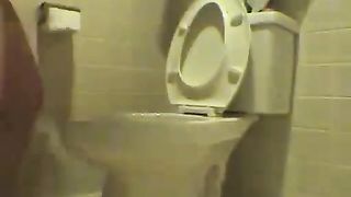 Poop over the toilet
