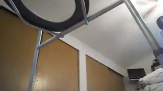 Chubby girl sits on a homemade toilet